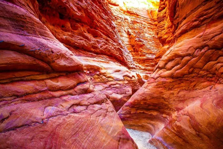 Vibrant layered rock walls inside the dramatic Colored Canyon, Sharm El Sheikh.